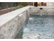 A stunning pool with stacked stone water feature at 6570 Aurora View St, Las Vegas, NV 89135