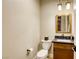 Powder room features a modern vanity, toilet, and neutral color scheme at 6570 Aurora View St, Las Vegas, NV 89135