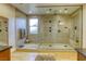 Large, modern shower featuring multiple shower heads at 6570 Aurora View St, Las Vegas, NV 89135