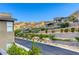 Scenic street view showcasing modern home exteriors and well-maintained landscaping against a mountain backdrop at 6570 Aurora View St, Las Vegas, NV 89135
