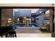 Outdoor oasis featuring a pool, stylish seating, and architectural design at 671 Scenic Rim Dr, Henderson, NV 89012