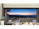Open-air balcony furnished with comfortable seating, boasting panoramic views of the city skyline and distant mountains at 671 Scenic Rim Dr, Henderson, NV 89012
