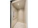 Private elevator featuring wood paneling, carpet, and a control panel for convenient access to all floors at 671 Scenic Rim Dr, Henderson, NV 89012