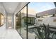 Modern exterior featuring a pool, lush plants, and an open passageway at 671 Scenic Rim Dr, Henderson, NV 89012