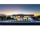 Contemporary home with unique design elements and manicured landscaping creating an inviting curb appeal at 671 Scenic Rim Dr, Henderson, NV 89012