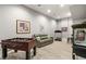 Spacious game room with a foosball table, comfortable seating, and a vintage popcorn machine at 671 Scenic Rim Dr, Henderson, NV 89012