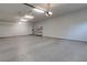 Clean and spacious garage with ample storage cabinets and a modern epoxy floor at 671 Scenic Rim Dr, Henderson, NV 89012