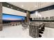 Gourmet kitchen with high-end appliances and an island bar, seamlessly connected to outdoor living space at 671 Scenic Rim Dr, Henderson, NV 89012