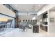 Modern kitchen with an island, stainless steel appliances, and seamless access to outdoor grilling at 671 Scenic Rim Dr, Henderson, NV 89012