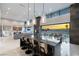 Modern kitchen with an island bar, and easy access to the living area and outdoor dining at 671 Scenic Rim Dr, Henderson, NV 89012