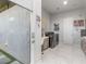 Spacious laundry room with modern appliances and creative wall decorations at 671 Scenic Rim Dr, Henderson, NV 89012