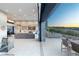 Expansive living room extends to an outdoor dining area with breathtaking views at 671 Scenic Rim Dr, Henderson, NV 89012