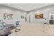 Spacious living room area with neutral tones, hardwood floors, and elegant furnishings at 671 Scenic Rim Dr, Henderson, NV 89012