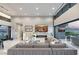 Bright living room with sleek fireplace and large windows, seamlessly blending indoor and outdoor living spaces at 671 Scenic Rim Dr, Henderson, NV 89012