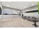 Bright and airy living room with large windows offering scenic views and hardwood flooring at 671 Scenic Rim Dr, Henderson, NV 89012
