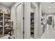 A well-stocked pantry with shelves for storing food and kitchen appliances, next to the kitchen at 671 Scenic Rim Dr, Henderson, NV 89012