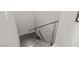 Modern staircase design with sleek metal railings and elegant wood steps at 671 Scenic Rim Dr, Henderson, NV 89012