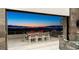 Outdoor terrace featuring a dining set and barbecue grill, offering a perfect space for entertaining with stunning city views at 671 Scenic Rim Dr, Henderson, NV 89012