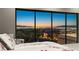 Stunning bedroom view showcases city skyline and landscape through expansive windows for picturesque scenery at 671 Scenic Rim Dr, Henderson, NV 89012
