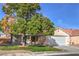 Lovely single-story home with a red tile roof, two-car garage, and a well-manicured lawn at 7021 Feather Pine St, Las Vegas, NV 89131