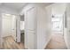 Bright hallway featuring new laminate flooring and easy access to other rooms at 7021 Feather Pine St, Las Vegas, NV 89131