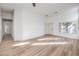 Spacious living room with new wood flooring and neutral paint at 7021 Feather Pine St, Las Vegas, NV 89131
