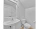 Clean bathroom with white pedestal sink, toilet, and neutral color scheme at 7621 Breed Hill St, Las Vegas, NV 89149