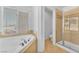 Corner garden tub with window in a naturally lit bathroom at 7621 Breed Hill St, Las Vegas, NV 89149