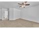Carpeted bedroom with a ceiling fan and closet at 7621 Breed Hill St, Las Vegas, NV 89149