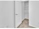 Walk-in closet with built-in shelves and carpet flooring, offering ample storage space at 7621 Breed Hill St, Las Vegas, NV 89149