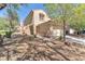 Charming two-story home with a tile roof, attached garage, and mature landscaping at 7621 Breed Hill St, Las Vegas, NV 89149
