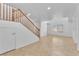 Bright foyer with a staircase, tile flooring, and neutral wall paint at 7621 Breed Hill St, Las Vegas, NV 89149