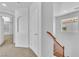 Hallway leading to carpeted bedrooms with views outside at 7621 Breed Hill St, Las Vegas, NV 89149