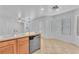 Bright kitchen featuring wood cabinets, granite countertops, and modern stainless steel appliances at 7621 Breed Hill St, Las Vegas, NV 89149