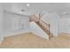 Open living room showcases tile flooring and staircase with natural light at 7621 Breed Hill St, Las Vegas, NV 89149