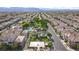 Aerial view showcasing community amenities, including pools, parks, playgrounds, and residential neighborhoods at 8949 Merry Mullion Ct, Las Vegas, NV 89149