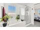 Bathroom featuring a soaking tub and shower with glass enclosure, offering a spa-like experience at 8949 Merry Mullion Ct, Las Vegas, NV 89149