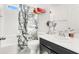 Bathroom featuring a tub, shower, and decorative elements, offering a calming retreat at 8949 Merry Mullion Ct, Las Vegas, NV 89149