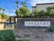 Welcoming community sign for Tapestry by Astoria Homes, surrounded by lush landscaping at 8949 Merry Mullion Ct, Las Vegas, NV 89149