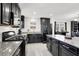 Well-equipped kitchen featuring granite countertops, ample cabinetry, and stainless steel appliances at 8949 Merry Mullion Ct, Las Vegas, NV 89149