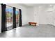 Bright room with black out curtains, gray tile floors, and outdoor access at 8949 Merry Mullion Ct, Las Vegas, NV 89149