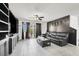 Comfortable living room features a dark sofa and modern decor at 8949 Merry Mullion Ct, Las Vegas, NV 89149