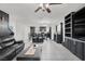 Bright open-concept living and dining area with neutral décor and tiled floors at 8949 Merry Mullion Ct, Las Vegas, NV 89149