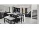 Open living space with dark furnishings, tiled flooring, and natural light at 8949 Merry Mullion Ct, Las Vegas, NV 89149