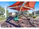 Community playground featuring sun-shading, slides, and climbing features for outdoor activities and fun at 8949 Merry Mullion Ct, Las Vegas, NV 89149