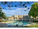 Community pool with a gazebo, lounge chairs, and picturesque neighborhood view for relaxation and recreation at 8949 Merry Mullion Ct, Las Vegas, NV 89149
