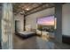 Bedroom with cityscape views, minimalist bed frame, and modern industrial design at 900 Las Vegas Blvd # 912, Las Vegas, NV 89101