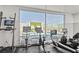 Well-equipped gym with stationary bikes and treadmill, offering a refreshing view of the outdoor pool area at 900 Las Vegas Blvd # 912, Las Vegas, NV 89101