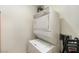 Compact laundry area with a stacked washer and dryer unit at 900 Las Vegas Blvd # 912, Las Vegas, NV 89101