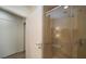 Close-up of a modern shower with glass doors and stylish tile work at 900 Las Vegas Blvd # 912, Las Vegas, NV 89101